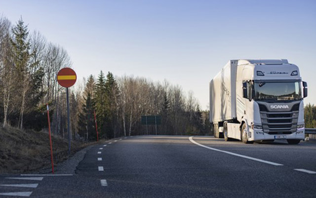 Scania lorry on road in wintry scene